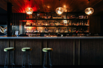 An empty bar with overhanging lights