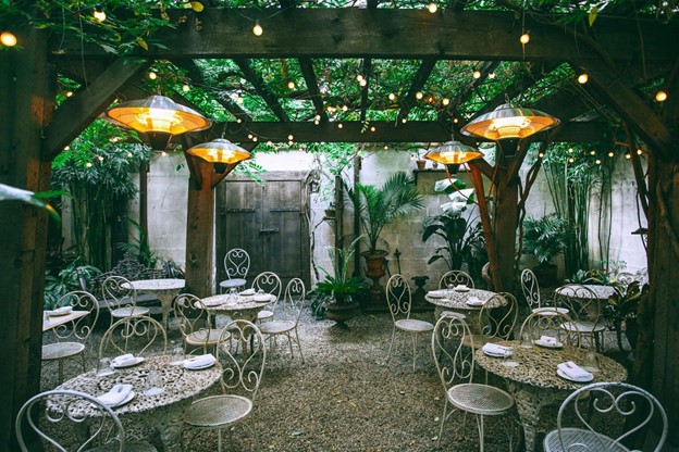 Backyard event set up under a pergola