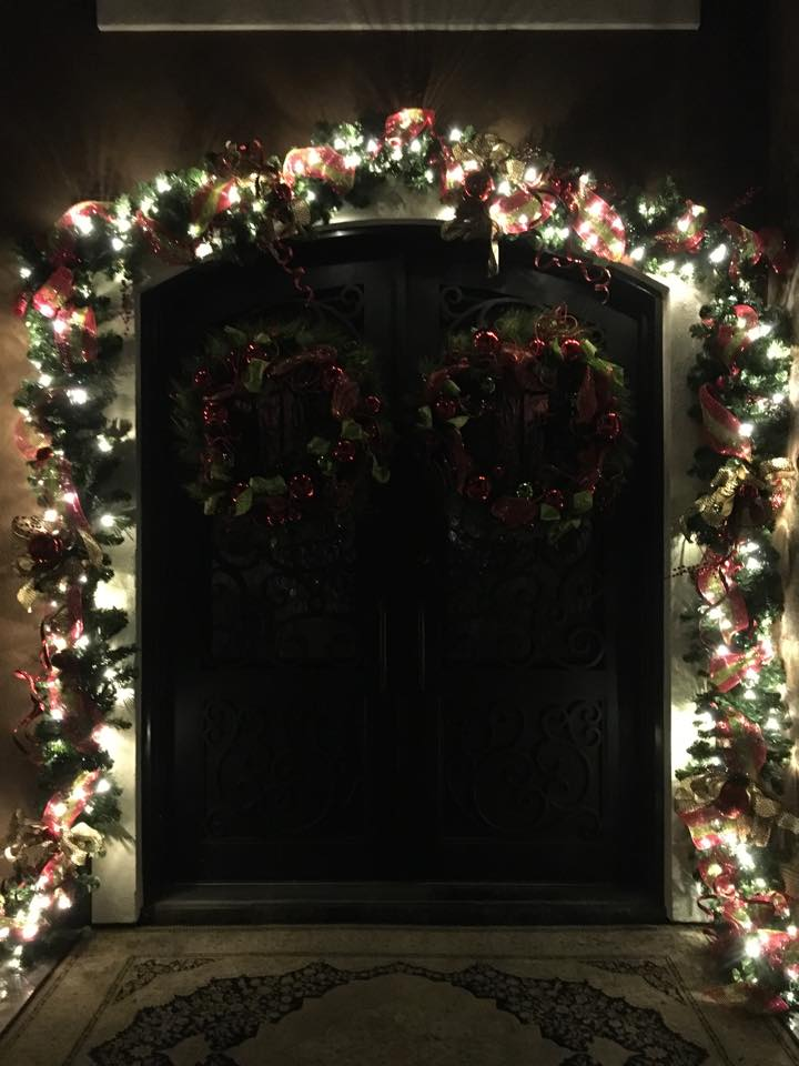 Christmas lights installed on a door 